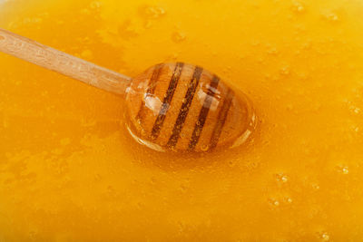 High angle view of coffee on orange background