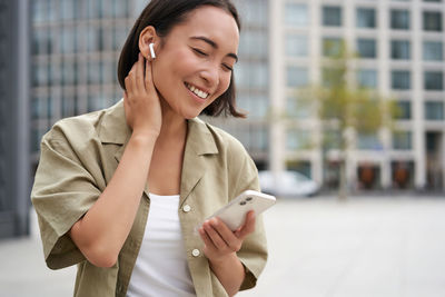 Young businesswoman using mobile phone