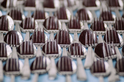 Full frame shot of forks and spoons on table