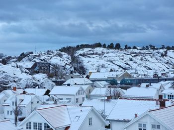 Buildings in town against sky