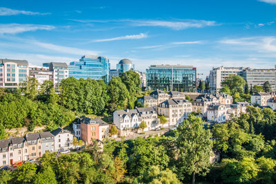 High angle view of trees and buildings against sky