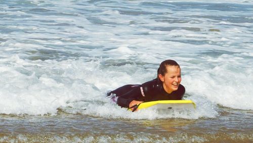 Portrait of happy girl in sea