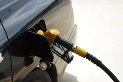 Refueling petrol into car gas tank.close up shot of petrol gun or nozzle fueling gas into car tank.