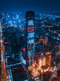 High angle view of illuminated city buildings at night