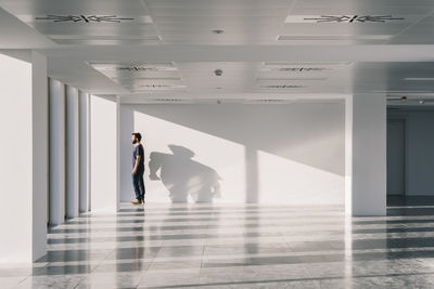People walking in corridor of building