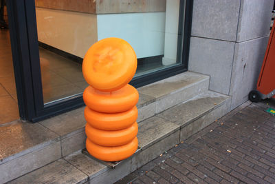 High angle view of orange on floor against wall