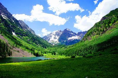 Scenic view of mountains against cloudy sky