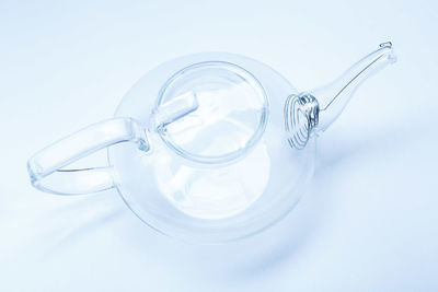 High angle view of empty glass against white background