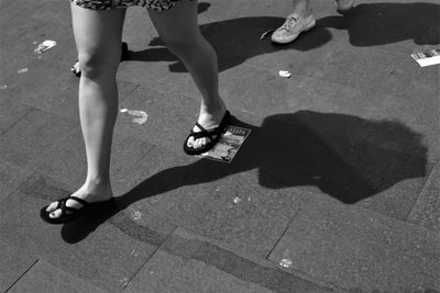 Low section of woman standing on floor