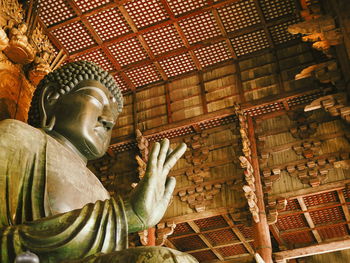 Low angle view of buddha statue