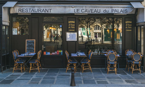 Empty chairs and tables in cafe