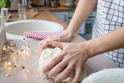 Cropped hands of person preparing food