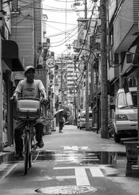 People on road in city