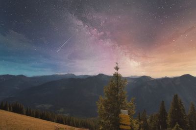 Scenic view of mountains against sky at night