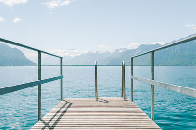 Pier on sea against clear sky