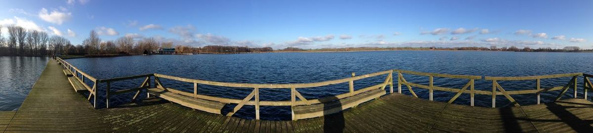 Panoramic view of sea against blue sky