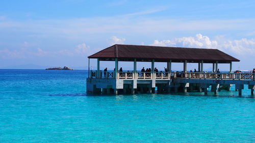 Boat jetty, clear blue sea, clear blue sky