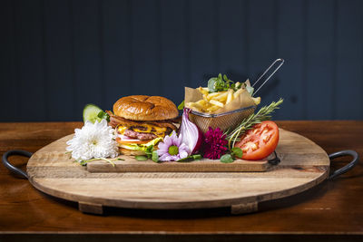 Various fruits on cutting board on table