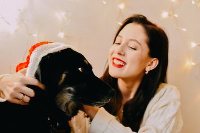 Portrait of young woman with dog