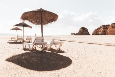 Empty deck chairs at beach during quarantine times