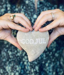 Close-up of hands holding heart shape