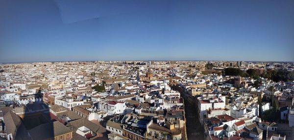 High angle shot of townscape against clear blue sky