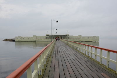 Pier over sea against sky