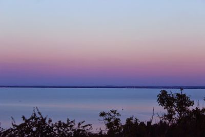 Scenic view of river at sunset