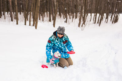 Full length of person on snow covered field