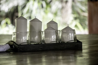 Close-up of glass container on table