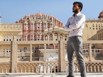 Man standing at historical building