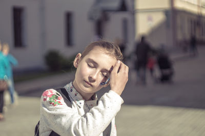 Close-up of girl on street