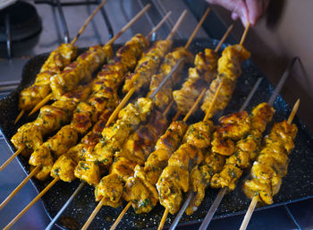 High angle view of meat on barbecue grill