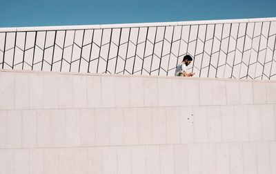 Woman hand against sky