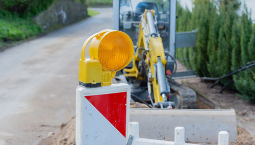 Close-up of yellow flag on road