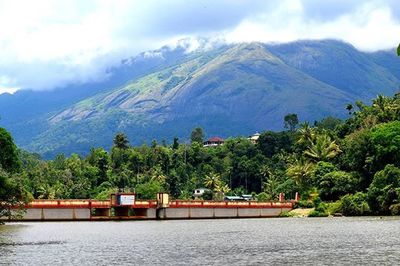 Scenic view of lake against cloudy sky