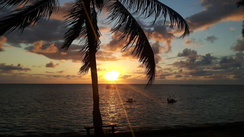 Scenic view of sea against sky at sunset