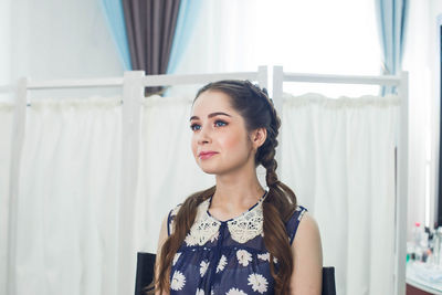 Portrait of young woman looking away