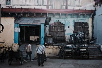 People working at construction site in city