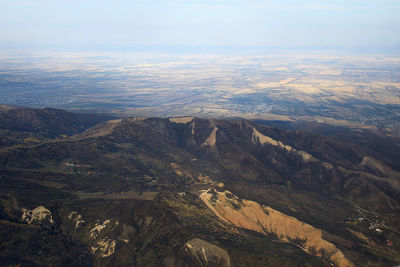 A view over the mountain valley and fields in the distance in autumn, sunlight, aerial photography