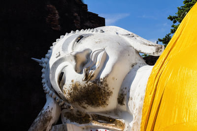 Close-up of statue against building