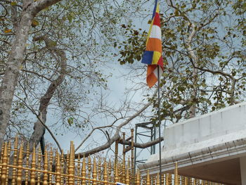 Low angle view of street light against sky