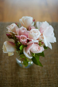 Close-up of pink roses on table