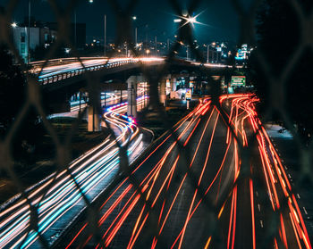 High angle view of light trails on road at night