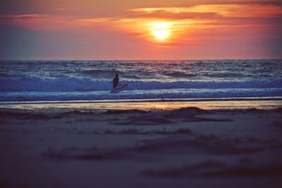 Scenic view of sea at sunset