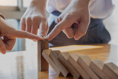 Midsection of man holding table