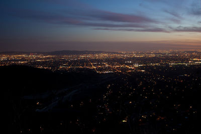 High angle view of illuminated buildings in city at night
