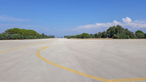 Surface level of airport against blue sky