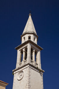 Low angle view of building against clear blue sky