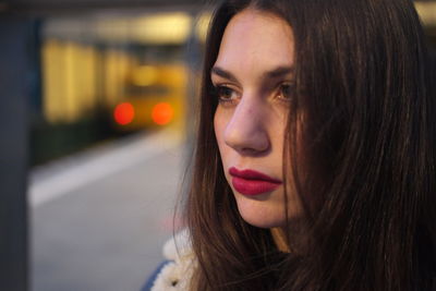 Close-up of young woman looking away